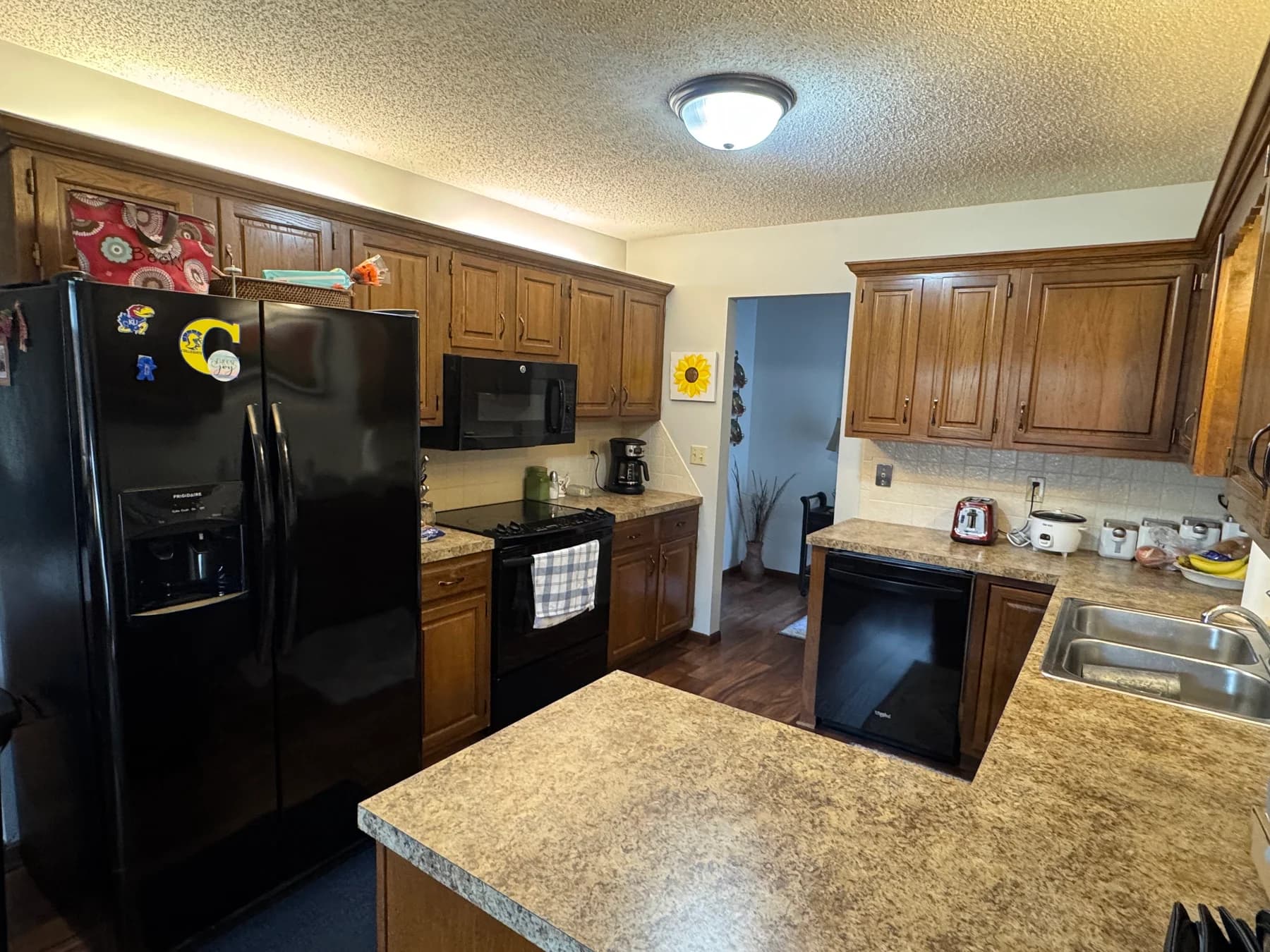 Original dark wood kitchen before the Herringbone remodel