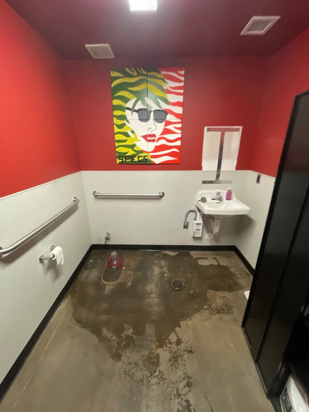 Original commercial bathroom before the custom tile renovation