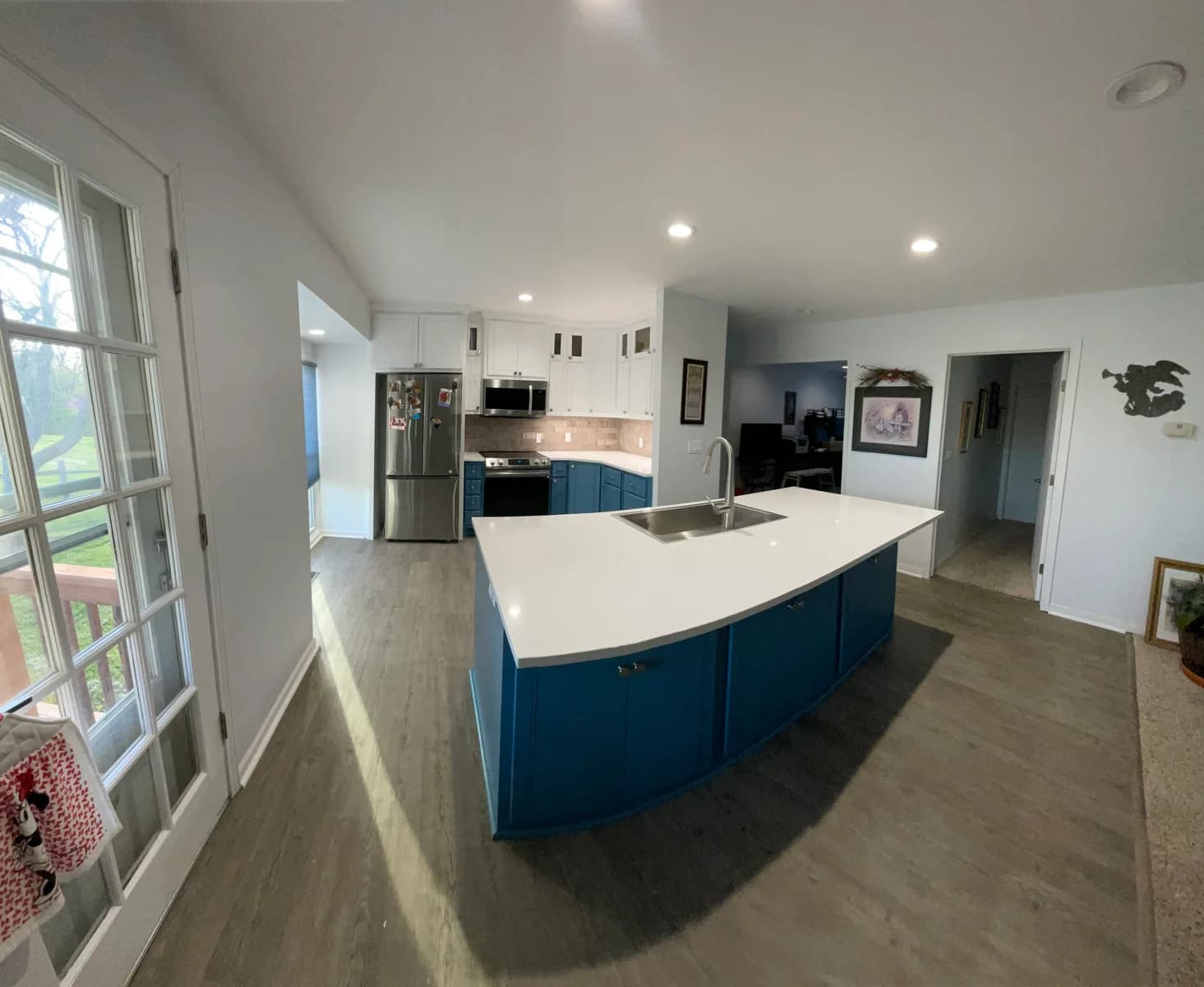 Wide view of the completed kitchen layout and navy island